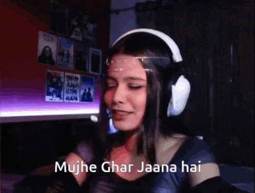 a girl wearing headphones says mujh ghar jaana hai