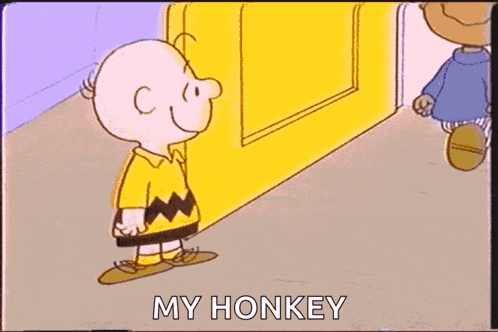 a cartoon of charlie brown and a boy holding hands with the words `` my honkey '' written on the bottom .