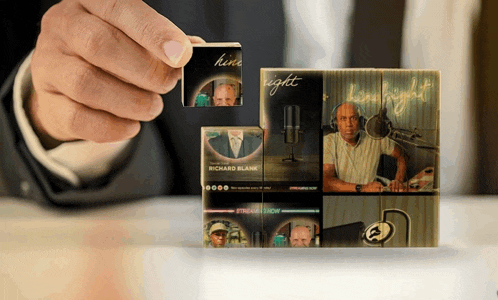 a hand holds up a stack of cards with richard blank on them