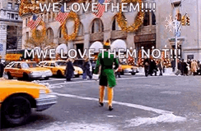 an elf is crossing a street in front of a building with christmas decorations .