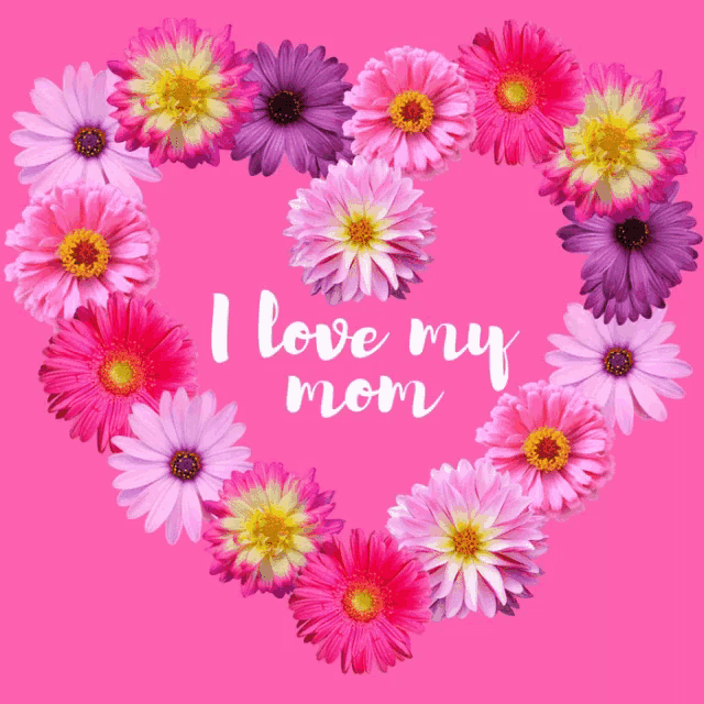 a heart made of flowers with the words " i love my mom " written on it