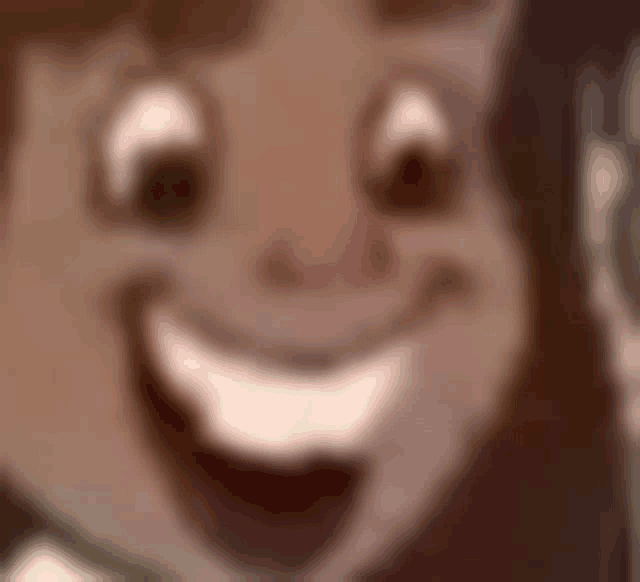 a close up of a cartoon character 's face with a smile on it .