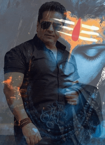 a man wearing sunglasses stands in front of a painting of a woman with the word shiva written on it