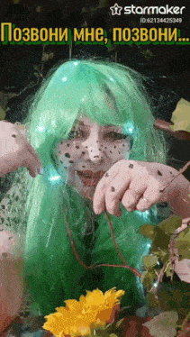 a woman in a green wig with a starmaker logo on the top right