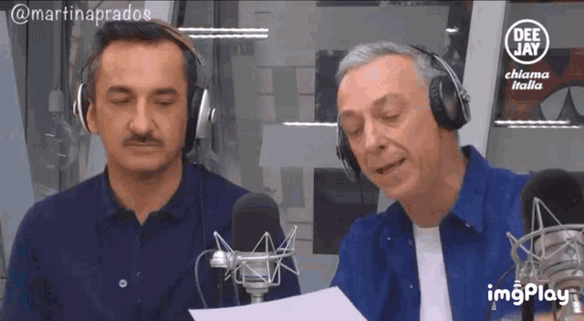 two men wearing headphones are singing into microphones for dee jay