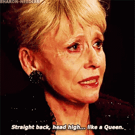 an older woman is crying and saying straight back head high like a queen .
