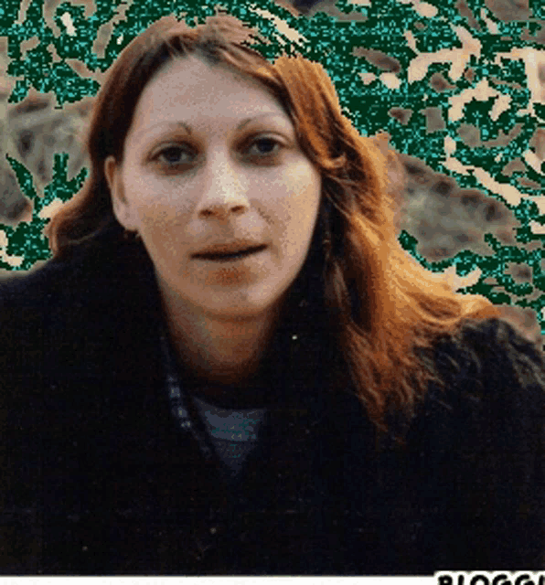 a close up of a woman 's face with a blurry background that says blog on it