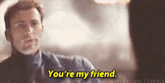 a man in a suit and tie is talking to another man and says you 're my friend