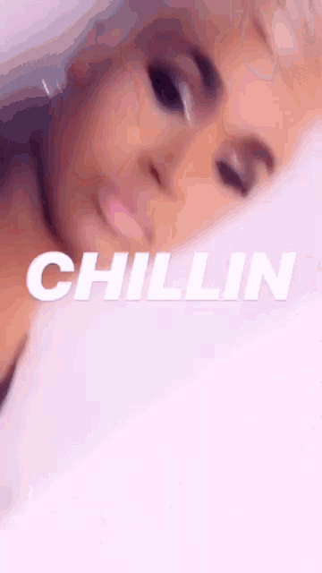 a close up of a woman 's face with the word chillin written on the bottom
