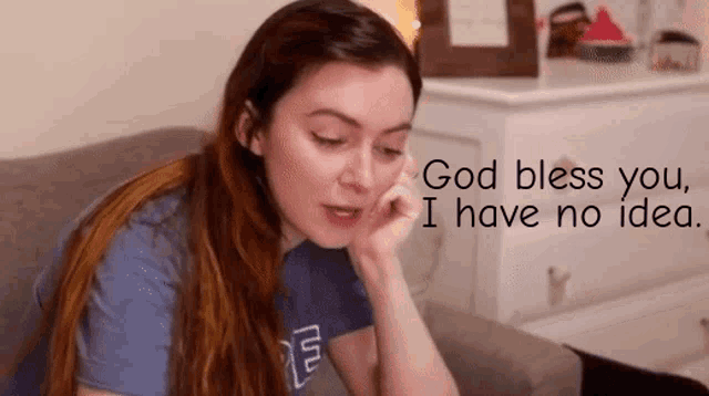 a woman is sitting on a couch with her hand on her face and the words god bless you i have no idea behind her