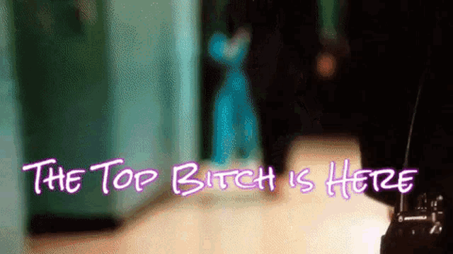 the top bitch is here is written in purple letters