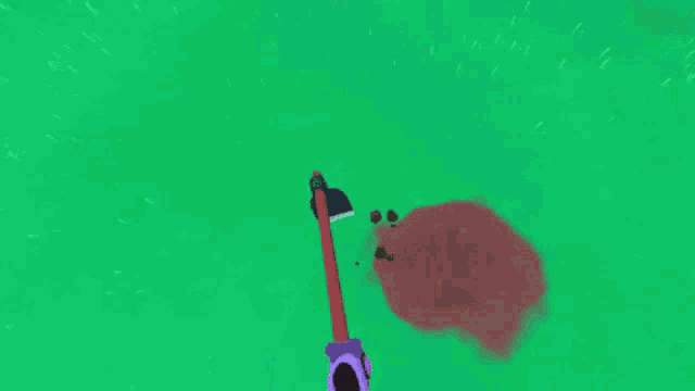 a person is holding a red stick in front of a green background in a video game .
