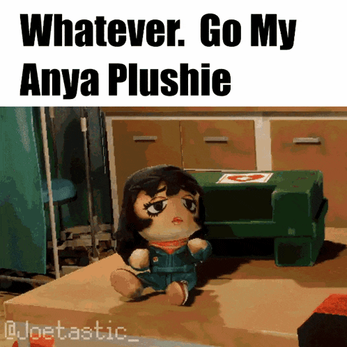 a picture of anya plushie sitting on a table with the caption whatever go my anya plushie