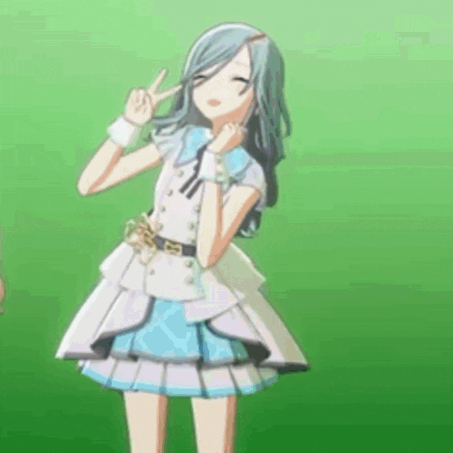 a girl in a white and blue dress is standing in front of a green background and making a peace sign .