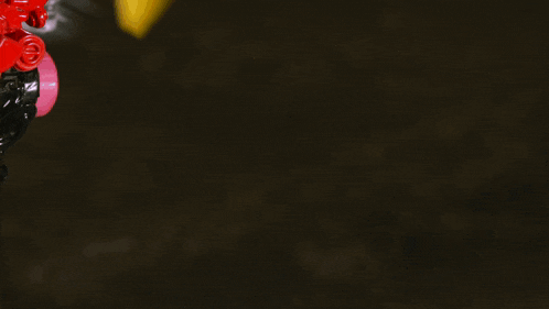 a blurry picture of a person 's legs with a yellow helmet in the background