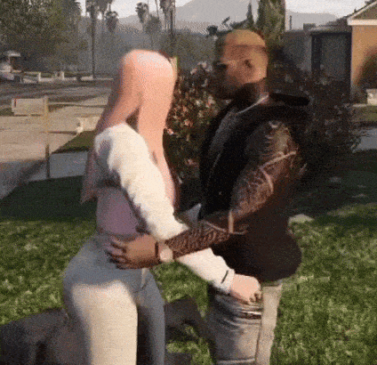 a man and a woman are hugging in a video game .