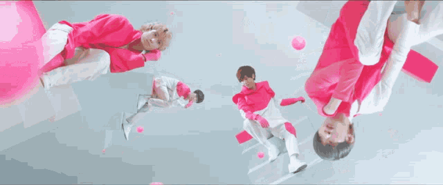 a man in a white jacket and pink pants squats down