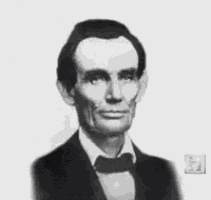 a black and white photo of abraham lincoln wearing a tuxedo and bow tie .