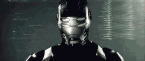 a close up of a man wearing a helmet and a suit