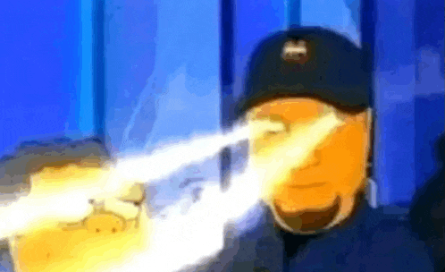 a man wearing a ny yankees hat is holding a beam of light in his eyes .