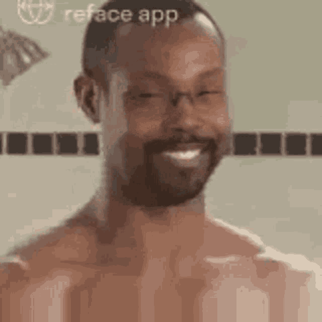 a shirtless man with a beard is smiling in a bathroom .