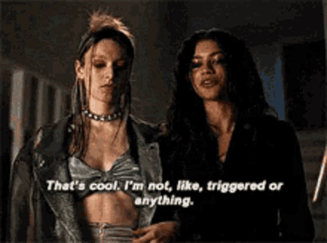 two women are standing next to each other and one of them says that 's cool i 'm not like triggered or anything