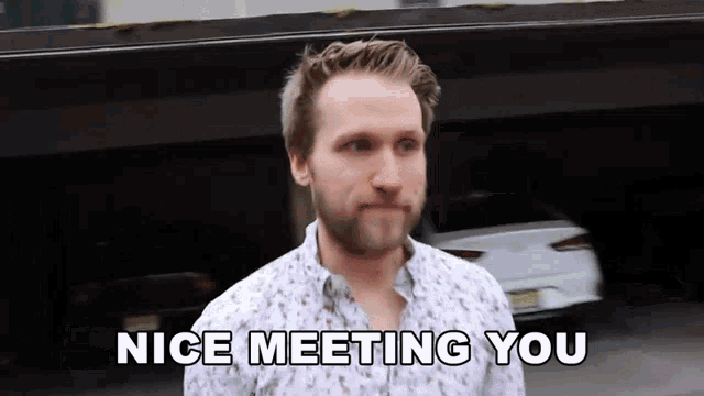 a man says " nice meeting you " in front of a white car