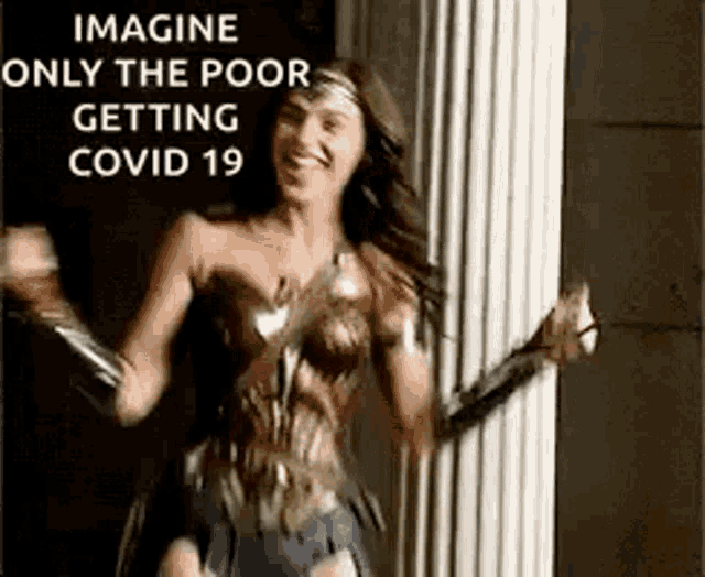 a woman dressed as wonder woman is dancing in front of a column .