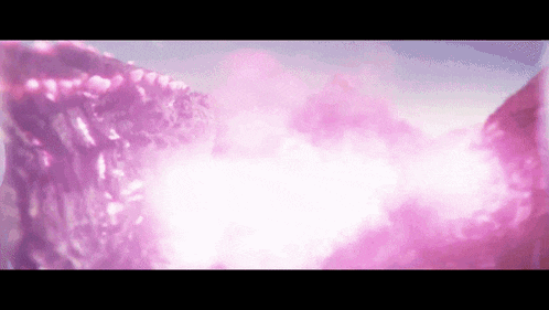 a close up of a purple smoke coming out of a rock .