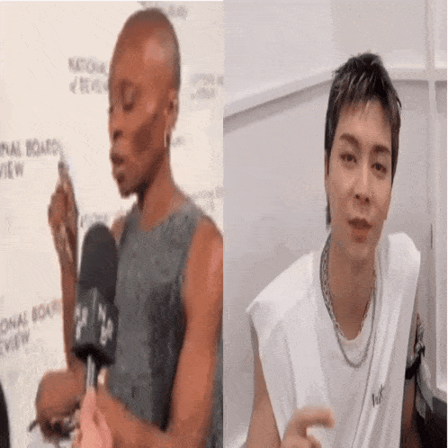 a woman is talking into a microphone next to a man .