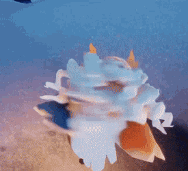 a fish is swimming in the ocean with a blue background .