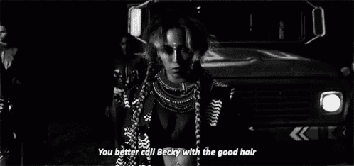 a black and white photo of a woman in front of a truck with the words you better call becky with the good hair .