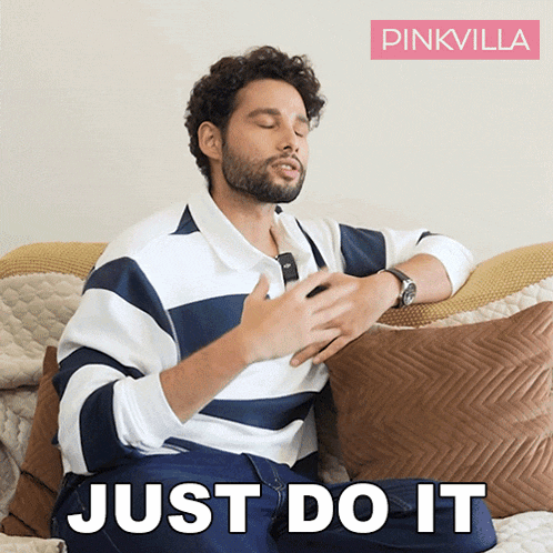 a man is sitting on a couch with his eyes closed and the words just do it behind him