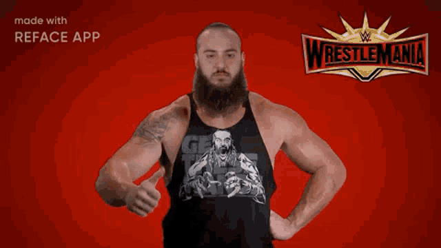 a man with a beard is pointing at the camera with a wrestlemania logo in the background