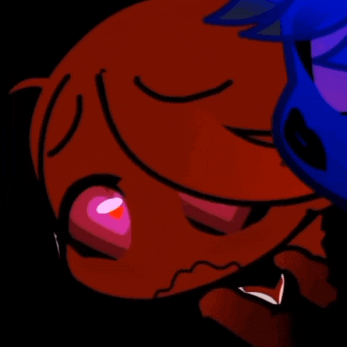 a close up of a cartoon character 's face with red eyes