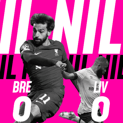 a soccer player with the number 11 on his shorts kicks the ball
