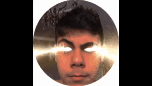 a man with glowing eyes is in a circle