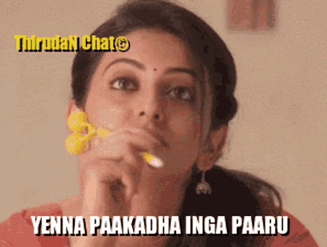 a woman is holding a yellow flower in her mouth and the words yenna paakadha inga paaru are above her
