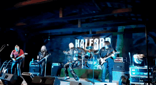 a group of musicians are on stage in front of a sign that says halffor