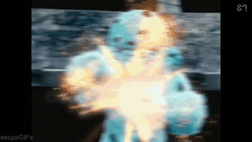 a blurred image of a person with the letters s on the bottom right