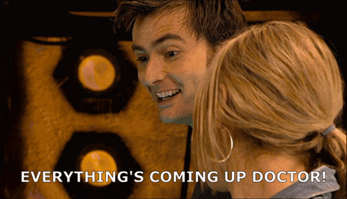 a man and a woman are looking at each other with the words everything 's coming up doctor behind them