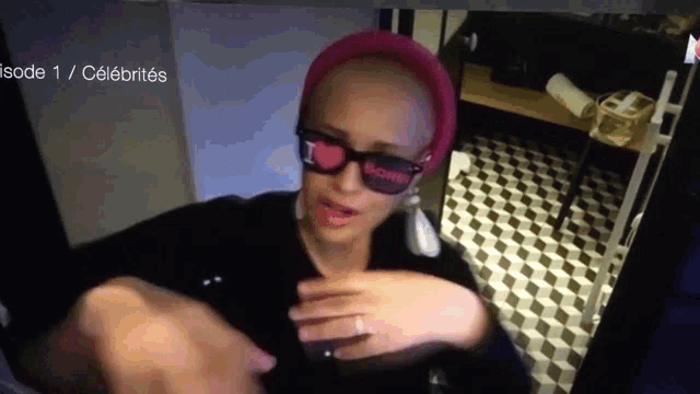 a woman wearing a pink hat and sunglasses with the word celebrities on the bottom