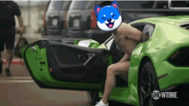 a shirtless man is getting out of a green sports car with the showtime logo in the background