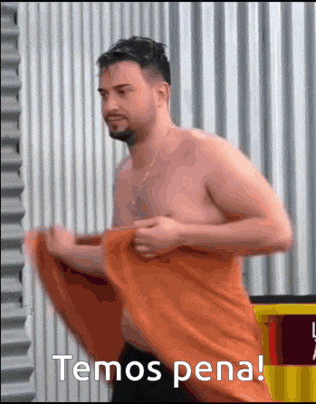 a shirtless man wrapped in an orange towel with the words temos pena written below him