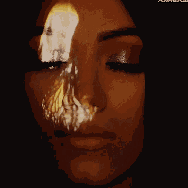 a woman 's face with a butterfly projected on it