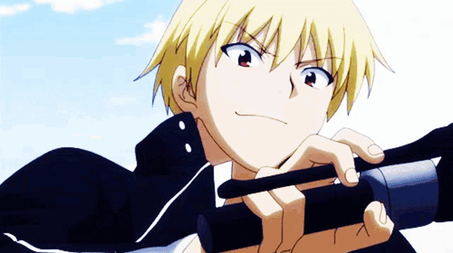 a man with blonde hair is holding a black object in his right hand