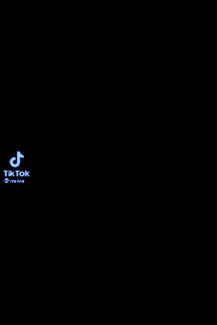a tik tok video of a person dancing in a blue room .