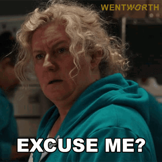 a woman in a blue hoodie is asking excuse me