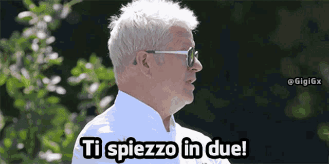 a man wearing sunglasses and a white shirt says " ti spiezzo in due "