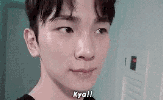 a close up of a young man 's face with the words `` kya !! '' written on it .